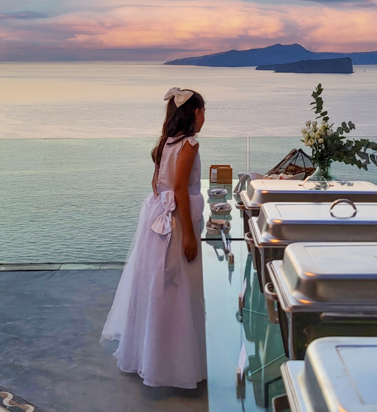 Luxury buffet catering in Santorini during a private event with caldera view